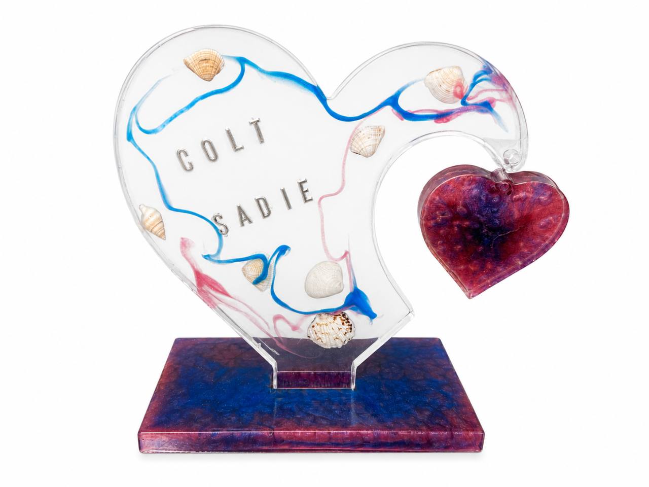 Finished Hanging Heart keepsake with blue and pink resin, seashells, and the names Colt and Sadie