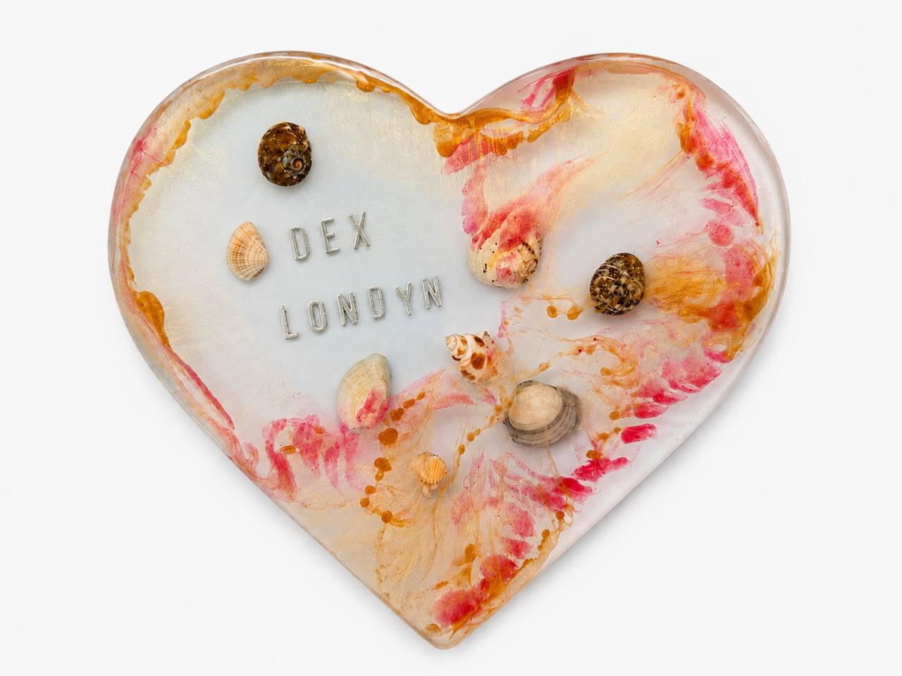 A finished heart with names and shells, kept on display
